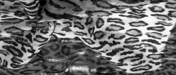 silk fabric black and white with leopard print. Lightweight silk with leopard print will perfectly match your design, looks stylish and not vulgar! Texture, background, pattern