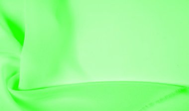 Doku - soluk yeşil ipek. Bu kumaşı herhangi bir mevsim için sıradan bir görünüme dönüştürebilirsin. Yumuşak siluetlere kolayca akabilen esnek, akışkan kumaşlar her şeyi yaratmanızı sağlar..