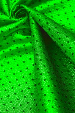 Küçük puantiyeli metalik parıltılı kumaş. Yeşil renk, çarpıcı bir metalik kumaş tasarımı ile bir sonraki etkinliğinizin ilgi odağı olacak. İnanılmaz pürüzsüz ve canlı bir parıltı sunacak.