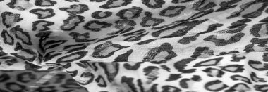 İpek kumaştan siyah beyaz leopar desenli. Leopar desenli hafif ipek senin tasarımına mükemmel uyacak, şık görünüyor ve kaba değil! Doku, arkaplan, desen