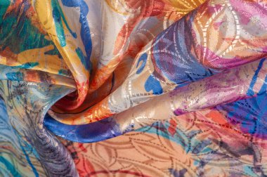 Boyalı bir palette ipek kumaş, soyut çizim, parlak renkler, kırmızı-sarı-mavi renk, sınırsız hayal gücü. doku, arkaplan, desen,