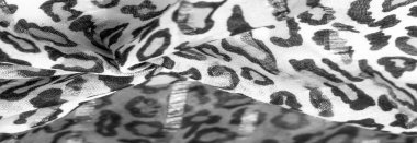 İpek kumaştan siyah beyaz leopar desenli. Leopar desenli hafif ipek senin tasarımına mükemmel uyacak, şık görünüyor ve kaba değil! Doku, arkaplan, desen