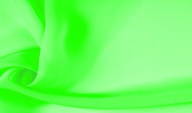 Doku - soluk yeşil ipek. Bu kumaşı herhangi bir mevsim için sıradan bir görünüme dönüştürebilirsin. Yumuşak siluetlere kolayca akabilen esnek, akışkan kumaşlar her şeyi yaratmanızı sağlar..