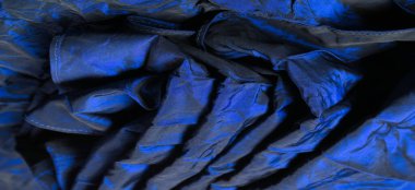 Mavi kumaş. Bu klasik mavi ipek shantung 'u gördüğünüzde, onu ele geçirmek isteyeceksiniz. Çok çeşitli çizgileri olan lüks ve basit bir malzeme. Tasarımınız için mükemmel bir seçim.