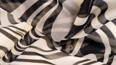 İpek kumaş, siyah beyaz soyut çizgiler. Soyut siyah beyaz desenli büyülü bir şekil. Retro modern dekor, tekstil sanatı, tasarım, doku, arkaplan, kalıp