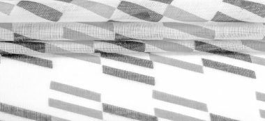 Siyah geometrik eşkenar dörtgen şekilli beyaz ipek kumaş. Karanlık. Geçmişi. Şablon.