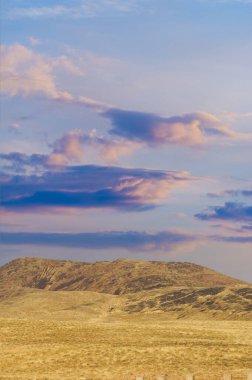 Steppe, prairie, plain, pampa. As the fiery orb descends below the horizon, tranquil prairie whispers secrets of an ancient land, Nature Reveals clipart