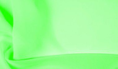 Doku - soluk yeşil ipek. Bu kumaşı herhangi bir mevsim için sıradan bir görünüme dönüştürebilirsin. Yumuşak siluetlere kolayca akabilen esnek, akışkan kumaşlar her şeyi yaratmanızı sağlar..