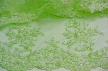 Soyut arkaplan tasarımlı açık yeşil dantel. Doku kartpostallar, posterler, dokular veya duvar kağıtları gibi çeşitli amaçlar için kullanılabilir. Eski dantel ve safir çizgileri içerir