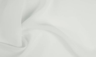 Kusursuz arkaplan dokusu - beyaz ipek. Bu antika beyaz ipek kumaşla klasik bir estetik elde et. Elinde pürüzsüz ve çıtır çıtır, zengin fildişi rengi göz kamaştırıcı bir parıltı yaratır..