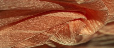 İpek kumaş. Kahverengi kırışık kumaş dokusu. Kahverengi buruşuk, dalgalı yüzey dokusu. Yakın plan, arkaplan, desen