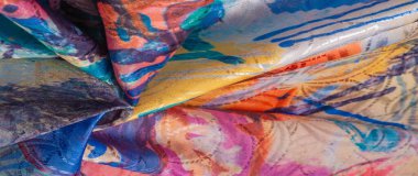 Boyalı bir palette ipek kumaş, soyut çizim, parlak renkler, kırmızı-sarı-mavi renk, sınırsız hayal gücü. doku, arkaplan, desen,