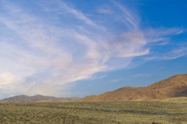 Steppe, prairie, plain, pampa. A breathtaking display of nature's splendor as the radiant sun gracefully bids farewell, casting a warm golden glow over the vast prairie. Nature's Farewell clipart