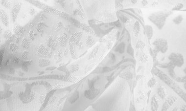 İpek kumaş, kar beyazı kumaş. Beyaz arka planda zarif çiçeklerin gölgeleri, Paisley 'nin fotoğrafı. Doku, desen, koleksiyon