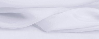 Bulanık, beyaz ipek kumaş. Organza kumaşları şeffaf ve çok hafiftir ama aynı zamanda dayanıklıdır ve berrak kumaşlarla kaplıdır. Projeleriniz gibi büyük girişimler için.