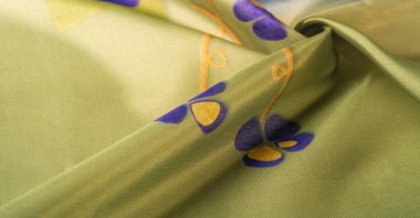 Arkaplan dokusu, ipek kumaş, parlak yeşil yeşil renk, küçük soyut kaya resimleri..