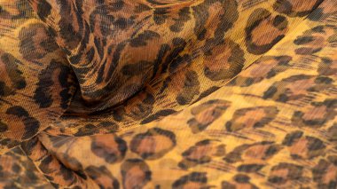 İpek kumaş, leopar derisi, kahverengi-sarı siyah tonlar, projeleriniz için sıcak Afrika safarisi, doku arka planı, desen
