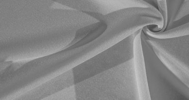 Yeşil ipek. Pürüzsüz, zarif yeşil ipek kumaş, fotokopi alanı ile soyut bir arkaplan olarak kullanılabilir. Renkli doku