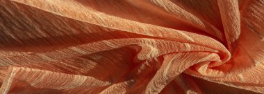 İpek kumaş. Kahverengi kırışık kumaş dokusu. Kahverengi buruşuk, dalgalı yüzey dokusu. Yakın plan, arkaplan, desen