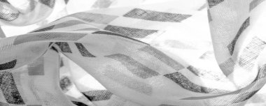 Siyah geometrik eşkenar dörtgen şekilli beyaz ipek kumaş. Karanlık. Geçmişi. Şablon.