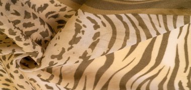 Kahverengi ve beyaz çizgili ipek kumaş, Afrika tarzı zebra derisi. Çizgili arka plan dokusu tekrarlanıyor. Tasarımcı için, tasarımın taslağı, dekoratörün çevresi.. 