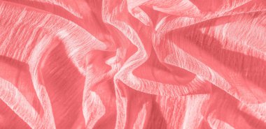 İpek kumaş. Kırmızı kırışık kumaş dokusu. Kırmızı buruşuk peri dokusu dalgalı yüzey, yakın çekim, yumuşak odak. arkaplan, kalıp