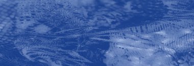 Işıldayan mavi dantel kumaş dokuma desenli ve akıcı, narin estetik, üst düzey moda ya da iç mekan uygulamaları için mükemmel..