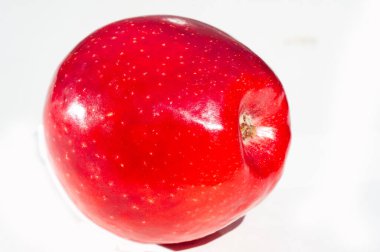 Elmaların parlak ve sulu tadını hisset. Arkana yaslan ve elmaların vitaminlerinin tadını çıkarırken rahatla. Rahatlama ve sağlıklı beslenmeyi birleştiren parlak bir kavram..