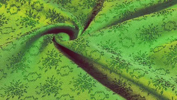 yeşil ipek kumaş. Pürüzsüz yeşil ipek ya da saten lüks kumaş dokusu soyut bir arkaplan olarak kullanılabilir. Lüks arka plan tasarımı. Doku, desen