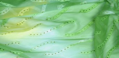 Kusursuz kaleydoskop. Kumaş ipek yeşil-mavi gözlükler. Canlı renkler ve deniz tarağı şekilleri, sarı, mavi ve yeşil geometrik ipek krep de chine renginde gerçekten eşsiz bir krep oluşturur..