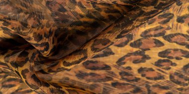 İpek kumaş, leopar derisi, kahverengi-sarı siyah tonlar, projeleriniz için sıcak Afrika safarisi, doku arka planı, desen