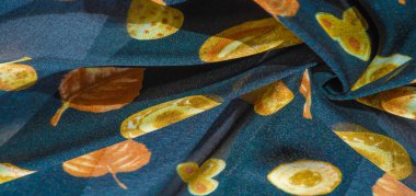 İpek kumaş, mavi ve sarı sonbahar yaprakları. Doku, arkaplan deseni