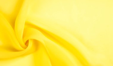 arkaplansız doku - sarı ipek. Soluk sarı renkli birinci sınıf ipek organza fevkalade bir kumaştır, hem kendi başına güzeldir hem de vurgu açısından bir aksesuardır..