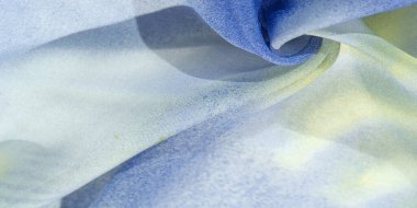 Yumuşak mavi, soyut desenleri ve yatak tonları olan ipek kumaş, sarı ve beyaz tonlarda. Doku, desen, koleksiyon