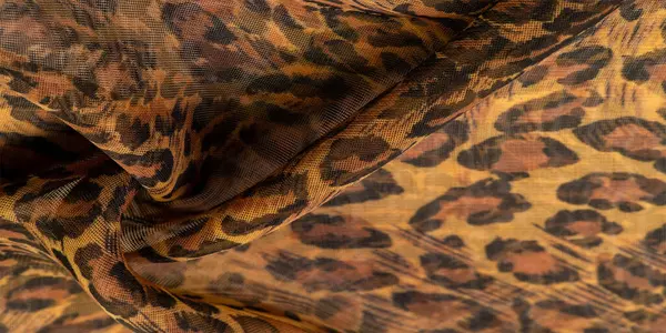 İpek kumaş, leopar derisi, kahverengi-sarı siyah tonlar, projeleriniz için sıcak Afrika safarisi, doku arka planı, desen