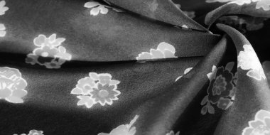 Beyaz desenli yumuşak siyah kumaş, moda veya ev dekorasyonu için yüksek kalite tekstil.