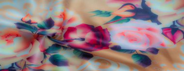 Kırmızı, pembe ve yeşil yapraklı turuncu güllerin sıcak renklerini içeren bulanık, canlı çiçek desenli kumaş görüntüsü. İpeksi doku ve yumuşak eğim renkleri zarif bir renk yaratır.