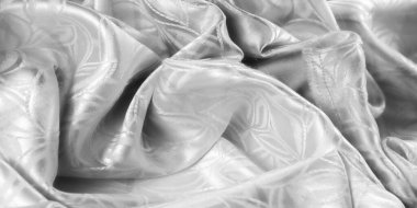 Yaprak desenli yüksek kaliteli beyaz saten kumaş yakın plan, pürüzsüz dokusunu ve karmaşık ayrıntılarını gösteriyor