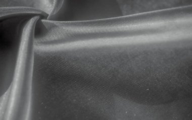 Bu görüntü, tek renkli kumaş kıvrımları serisi sunarak, dokuların ve eğrilerin soyut bir görüntüsünü oluşturur. Yumuşak kumaş ışığı yakalar, rahatlatıcı ve zarif bir estetik sunar..