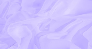 Yumuşak lavanta renklerinde bulanık kumaş kıvrımları soyut bir doku yaratır. Işığın ve gölgenin etkileşimi rahatlatıcı bir estetik sunuyor. Huzurlu ve rahatlatıcı arka planlar için mükemmel..