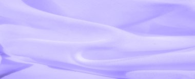 Bulanık yumuşak lavanta kumaş, akışkan hareket ve hassas kıvrımlar. Işığın nazik etkileşimi rahatlatıcı ve zarif bir görsel yaratarak onu soyut arka planlar ve tasarımlar için ideal hale getirir..