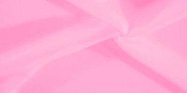 Bulanık pembe kumaş yumuşak, dalgalar halinde yakalanır. Pürüzsüz dokular ve açık pembe renkler, asgari ve zarif tasarımlar için mükemmel bir sükunet hissi uyandırıyor..