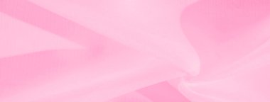 Bulanık pembe kumaş dokusu yumuşak kıvrımlar ve dalgalar yaratır. Pürüzsüz madde yumuşak ve narin bir estetik yaratıyor, yumuşaklık ve hafiflik hissi uyandırıyor..