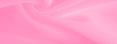 Hassas kıvrımları olan bulanık pembe kumaş dinamik bir görsel ilgi yaratıyor. Işık ve akış materyali çeşitli tasarım projeleri için uygun çok yönlü bir soyut arkaplan sunar.