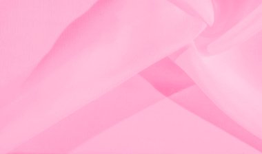 Bulanık pembe kumaş, dalgalı ve havadar. Kumaşın yumuşak ve ince hareketi, arka plan tasarımları veya tekstil projelerinde kullanılmak için mükemmel bir ışık ve zarif bir model oluşturur..