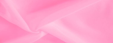 Açık pembe kumaşın bulanık kıvrımları yumuşak ve hassas bir doku oluşturur. Yumuşak kıvrımlar ve ince hareketler zarafet ve sükuneti çağrıştırıyor, arka plan veya tekstil tasarımı için mükemmel..