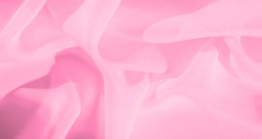 Yumuşak kıvrımları olan bulanık pembe kumaş narin, rüya gibi bir doku yaratır. Kumaşın şeffaf doğası, yaratıcı projeler için ideal, havadar ve ruhani bir kalite ekler..