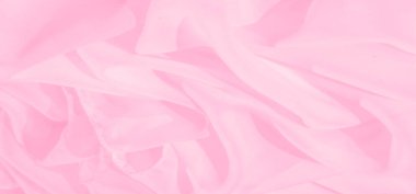 Bulanık açık pembe kumaş katmanları yumuşak dalgalarla örtüşerek soyut ve zarif bir kompozisyon oluşturur. Şeffaf malzeme, tasarım için mükemmel bir ortam sağlıyor..