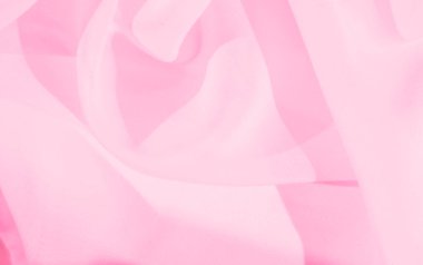 Bulanık pembe kumaş katmanları yumuşak ve akıcı soyut bir tasarım yaratır. Nazik dalgalar ve hassas kıvrımlarla. Şeffaf malzeme rüya gibi ve zarif bir dokunuş ekler. Sanatsal kompozisyonlar için idealdir..