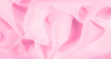 Bulanık pembe kumaş yumuşak kıvrımlar ve kıvrımlarla zarif bir şekilde akar, nazik ve soyut bir tasarım yaratır. Saf malzeme ruhani ve rahatlatıcı bir titreşim veriyor. Zarif projeler için mükemmel..